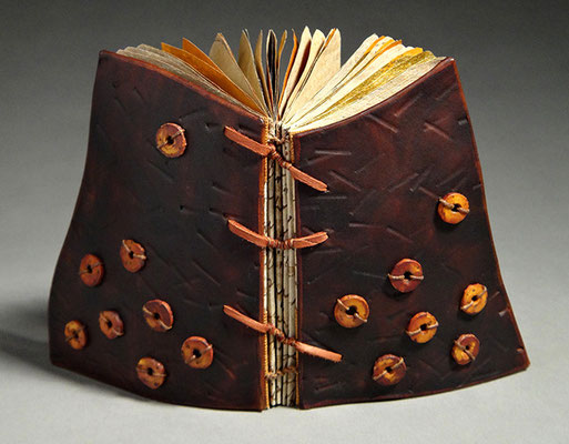 Luck, Book One (2016) mixed media on tea chest paper, wet-formed leather covers, unique, 4.75 x 6 x 3.5 inches