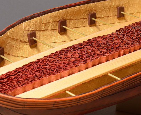 Adrift (2017) cuir bouilli formed leather, crinkled pastepaper, Lokta Metallic Gold paper, wood, brass rod, linen thread, 20 x 7.5 x 4.5 inches, Art Museum of Greater Lafayette