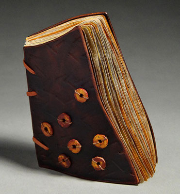 Luck, Book One (2016) mixed media on tea chest paper, wet-formed leather covers, unique, 4.75 x 6 x 3.5 inches