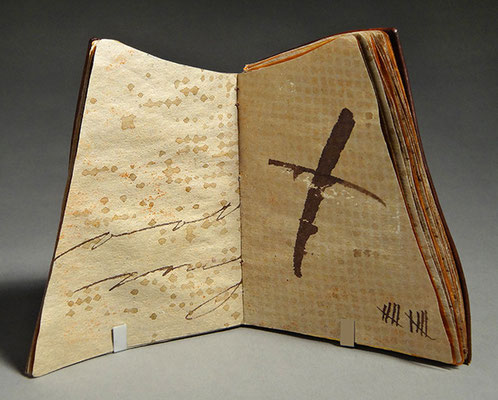 Luck, Book One (2016) mixed media on tea chest paper, wet-formed leather covers, unique, 4.75 x 6 x 3.5 inches