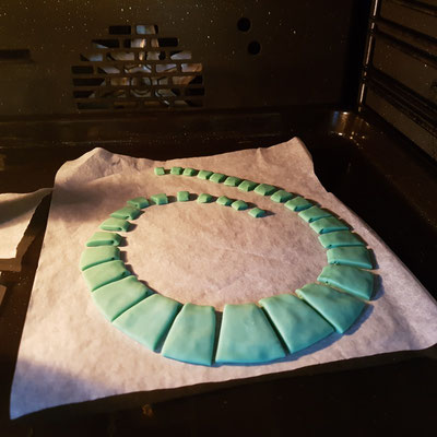 Polymer clay necklace in the oven, ready for baking
