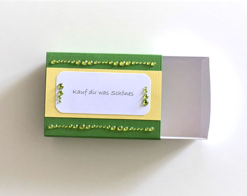 Schiebeschachtel (6) grün-weiß-gelb mit Text "Kauf dir was Schönes"
