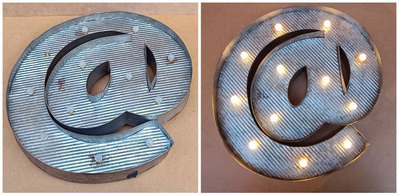 Luminoso @. Ref 13929. 42x40x5. Funciona con pilas