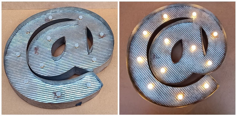Luminoso @. Ref 13929. 42x40x5. Funciona con pilas