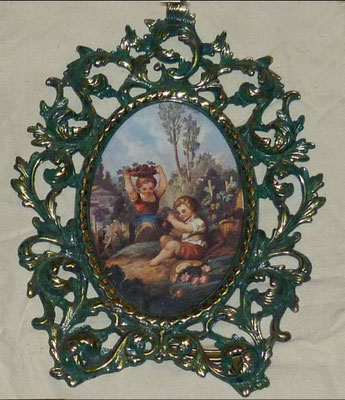 Portafotos oval metal para pared. 27x20