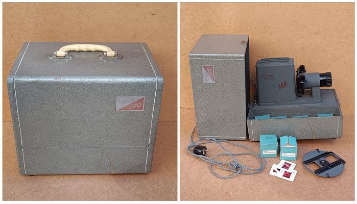 Proyector diapositivas con maletín Enosa 300 (Madrid) años 60. Dispone colección de diapositivas variadas (Arte, historia, biografias...). Ref GOY. 27x32x22