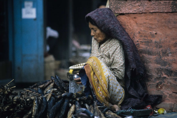 Old woman selling dried fish, Kathmandu, Nepal 1993