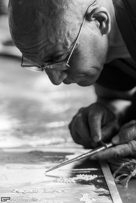 Zanskar - Monk exercising for a sand mandala in the monastery of Lingshed