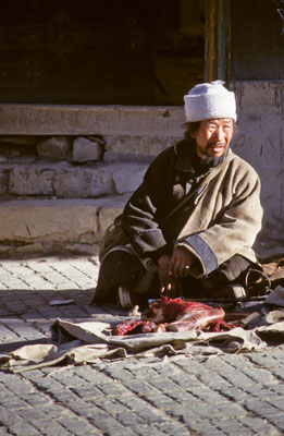 Man selling meat in the streets of Shigatse, Tibet 1993