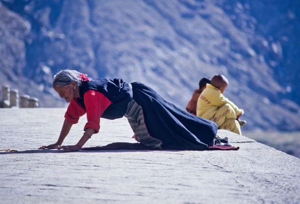 Woman prostrating, Drepung Monastery, Tibet 1993