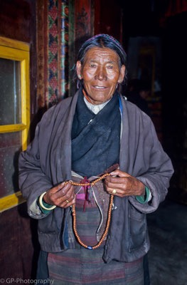 Old woman with prayer beads, Shigatse, Tibet 1993