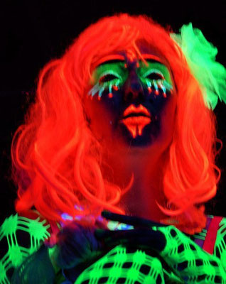 Blacklight paintings and performances own costume design