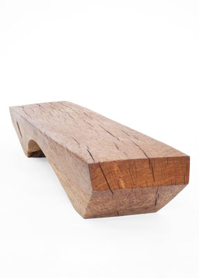 Archaic designer bench B2461 in organically perforated oak – a monumental functional sculpture by Jörg Pietschmann, celebrating the dense growth and rugged fissures of ancient timber to bring the eternal rhythm of the wildwood into premium minimalist spac