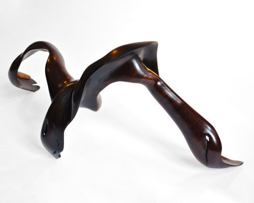 Abstract tropical driftwood sculpture S1031 by Jörg Pietschmann, featuring a dynamic, multi-legged organic form made of highly polished dark brown wood with warm reddish undertones, showcasing fluid curves and a smooth finish against a white background