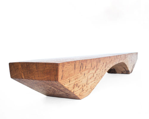 Archaic designer bench B2461 in organically perforated oak – a monumental functional sculpture by Jörg Pietschmann, celebrating the dense growth and rugged fissures of ancient timber to bring the eternal rhythm of the wildwood into premium minimalist spac