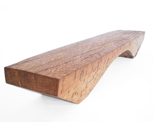Archaic designer bench B2461 in organically perforated oak – a monumental functional sculpture by Jörg Pietschmann, celebrating the dense growth and rugged fissures of ancient timber to bring the eternal rhythm of the wildwood into premium minimalist spac