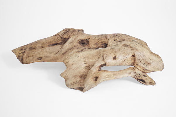 Abstract willow wood sculpture S1357 by Jörg Pietschmann, featuring a dynamic, organic bowl-like shape with natural openings, fluid hollows, and a smooth, light-brown grain texture on a white background.