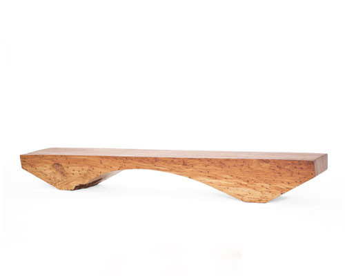Archaic designer bench B2461 in organically perforated oak – a monumental functional sculpture by Jörg Pietschmann, celebrating the dense growth and rugged fissures of ancient timber to bring the eternal rhythm of the wildwood into premium minimalist spac