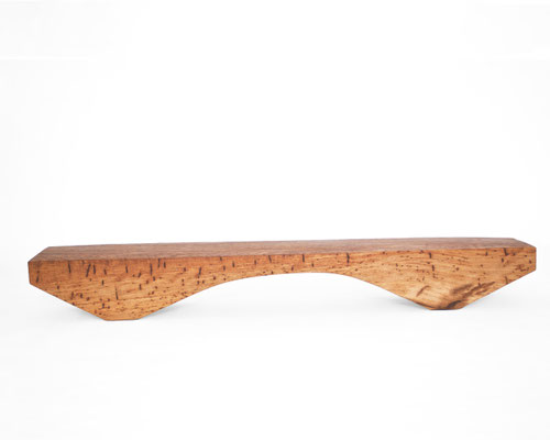 Archaic designer bench B2461 in organically perforated oak – a monumental functional sculpture by Jörg Pietschmann, celebrating the dense growth and rugged fissures of ancient timber to bring the eternal rhythm of the wildwood into premium minimalist spac