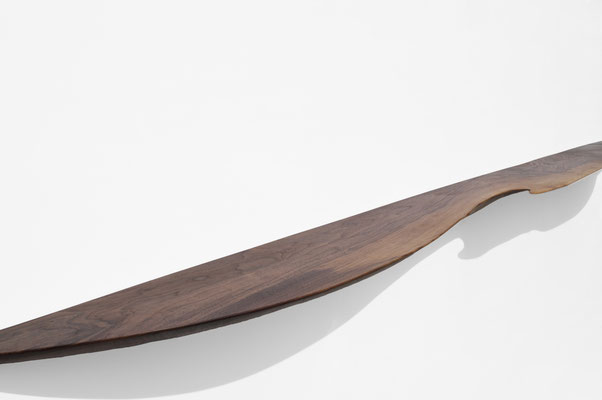 Dynamic sculpture shelf W2330 in rich walnut – an extraordinary piece of wall art by Jörg Pietschmann, mindfully carved to follow the natural flow of the fiber and enrich contemporary spaces with the living memory of nature.