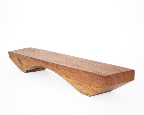 Archaic designer bench B2461 in organically perforated oak – a monumental functional sculpture by Jörg Pietschmann, celebrating the dense growth and rugged fissures of ancient timber to bring the eternal rhythm of the wildwood into premium minimalist spac