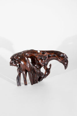 Abstract tropical driftwood sculpture S1202 by Jörg Pietschmann, featuring a dynamic, arched organic form made of highly polished dark wood with vibrant amber-orange inclusions, natural hollows, and unique texturing, isolated on a white background.