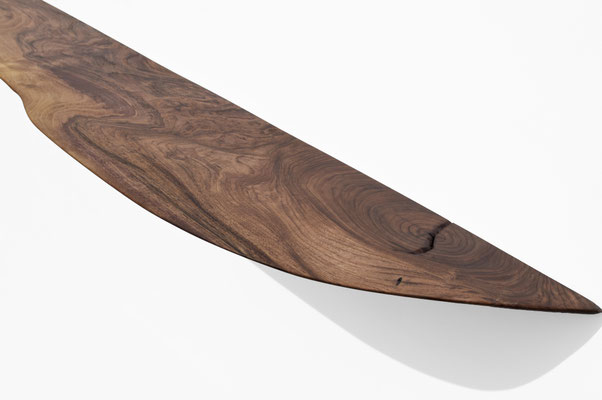 Dynamic sculpture shelf W2330 in rich walnut – an extraordinary piece of wall art by Jörg Pietschmann, mindfully carved to follow the natural flow of the fiber and enrich contemporary spaces with the living memory of nature.