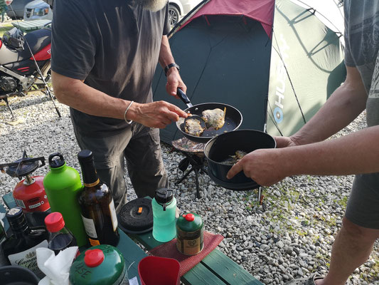 Jim is cooking fish, fished by him own