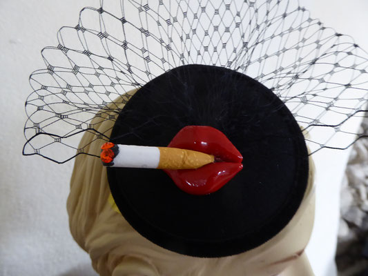 €75 black base, black tüll and a comb on back.....Lips with cigarette 