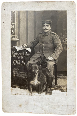 Soldier from WW1 with his black Wolfspitz/ Keeshond