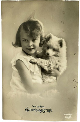Birthday card from 1912 showing a little girl with her Pomeranian puppy