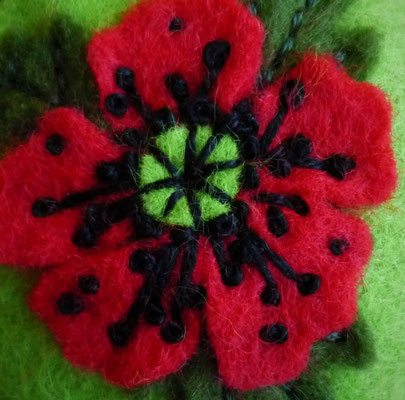 Green wrist pincushion with red poppies