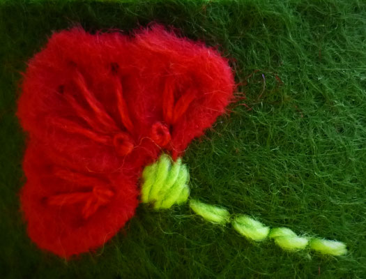 Green wrist pincushion with red poppies