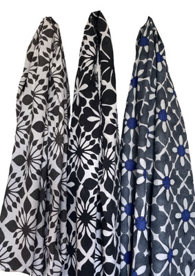 Lightweight and compact travel blanket with fringed edges.