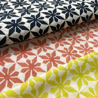 Each scarf tells a story through its intricate patterns, a blend of tradition and creativity.