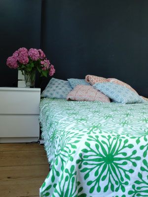 Minimalist design organic cotton blanket on a neatly made bed, handprinted in Delhi, India by Maasa Production Pvt. Ltd.