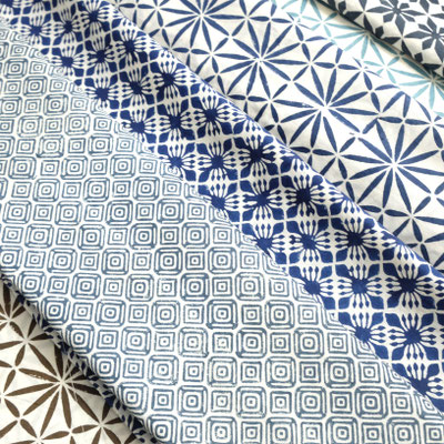 Assorted block print patterns in our Delhi factory shop. Join us in celebrating the art of block printing, where every fabric reflects a blend of tradition and innovation.