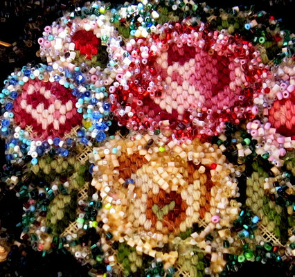 This centered tapestry is covered with seed beads