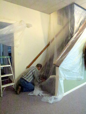 Covering the stairwell and other exposed areas with visqueen to keep the dust out. 