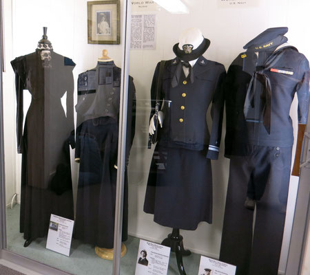 Main showcase features a WWI nurse's uniform and WWII U.S. Navy uniforms