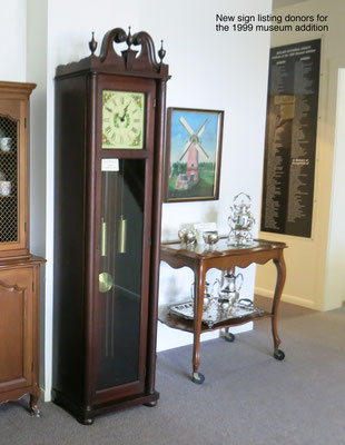 The grandfather clock (c. 1944) and tea cart (c. 1950s) were made by Colonial Manufacturing Company