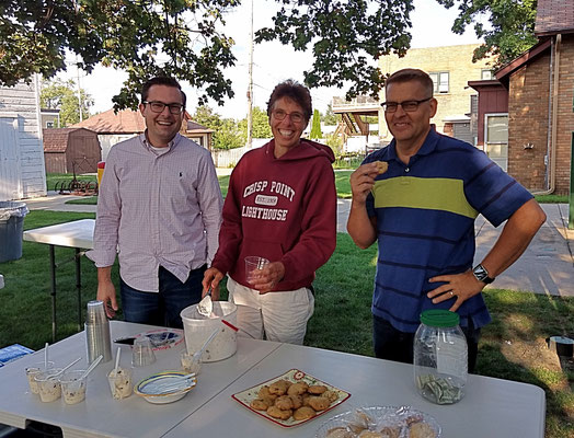 Board members, Justin, Mary Beth and Brian, scoop ice cream and eat cookies :)  :: photo by Arlene