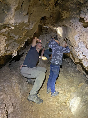 Wouter and Miguelito searching in every corner of the cave.