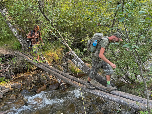Rick and me traversing on of the many makeshift bridges over a Ranodon-stream.