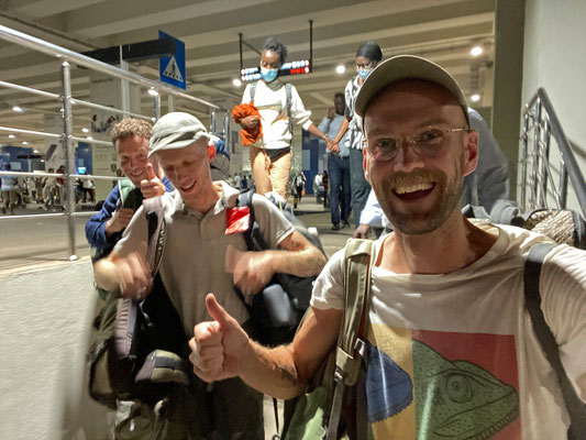 Three happy lads leaving Accra airport. With luggage this time.