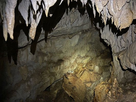The narrow space opens up to a big cavern. 