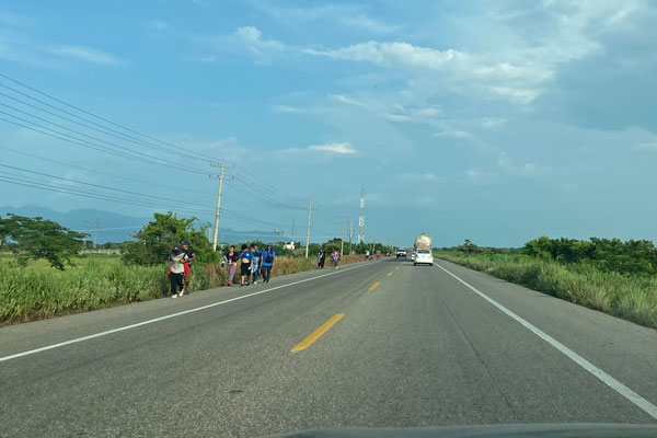 Refugees making their way up north all along the coastal highway. 