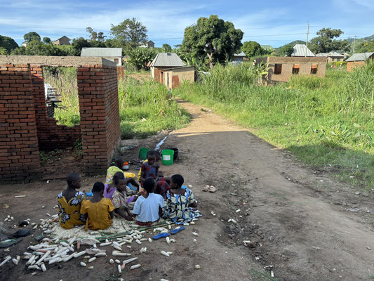 Children at work in front of our guesthouse.
