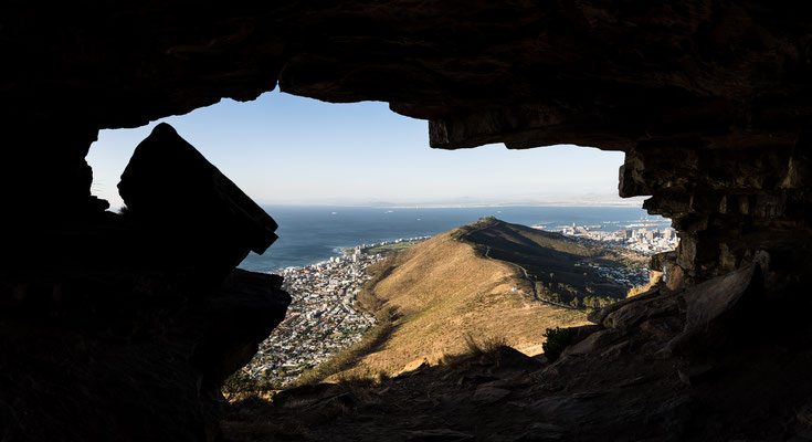 View of Signal Hill in Capetown out of a Lion's Head cave, South Africa