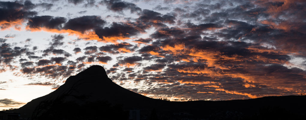 Silhouette of Lion's Head after sunset with burning sky